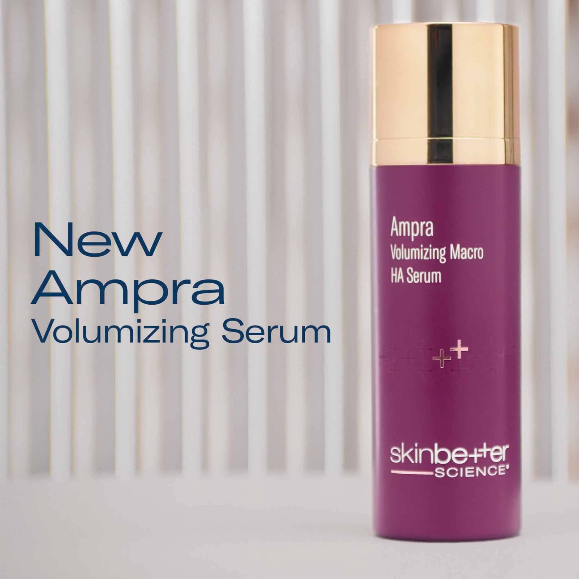 Purple skincare serum bottle with gold cap on a light background, featuring 'New Ampra Volumizing Serum' text.